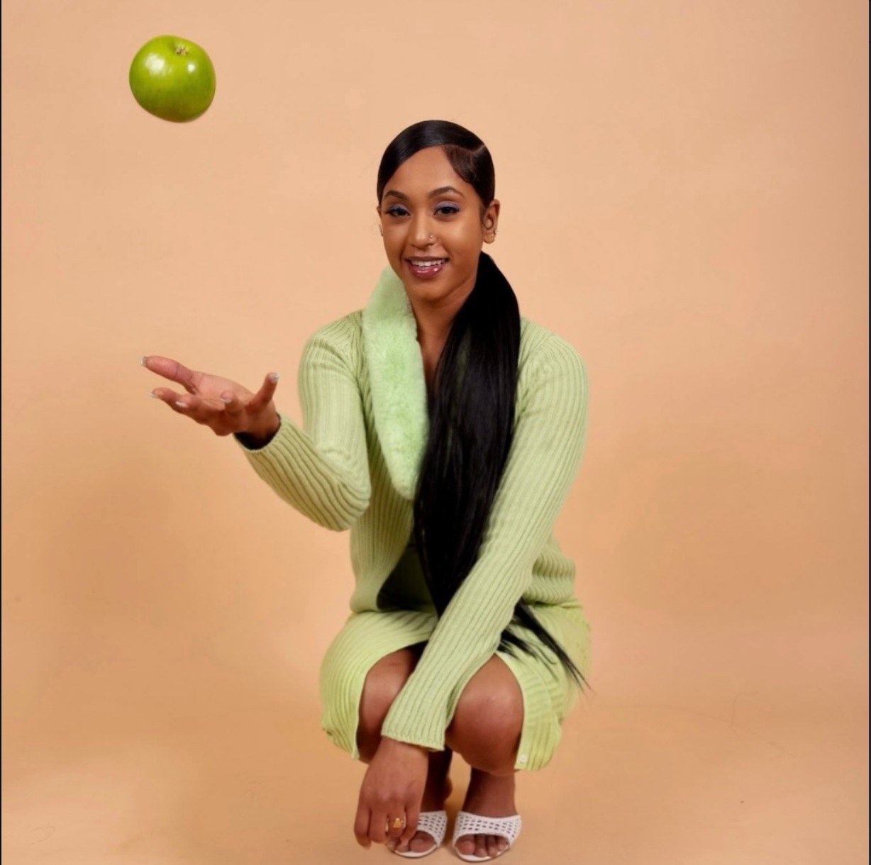 founder of Seuticals, tossing a green apple